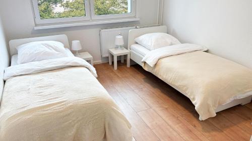 Stadtbezirk West Apartamento | Monteurwohnungen mit TV, Internet, Parkplatz, Waschmaschine, Küche, Balkon, Restaurants und Supermarkt