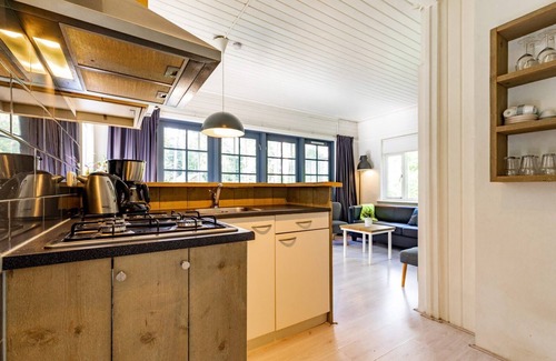 Norg Casa | Monumental 4-person bungalow, built under the architecture of the Amsterdam School with unique details.