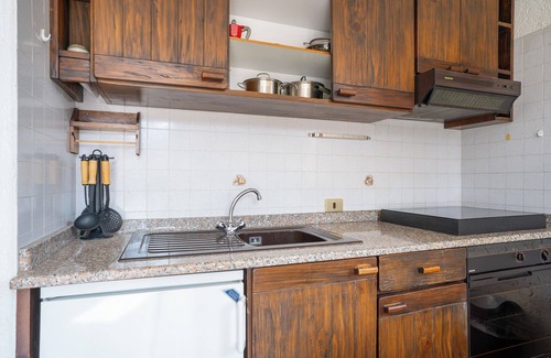 Barzio Apartamento | Mountain lodging with fireplace and mountain view