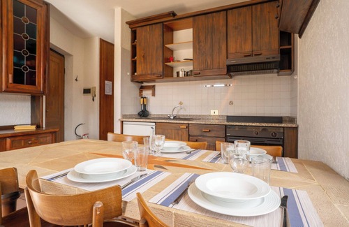 Barzio Apartamento | Mountain lodging with fireplace and mountain view