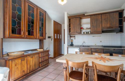 Barzio Apartamento | Mountain lodging with fireplace and mountain view
