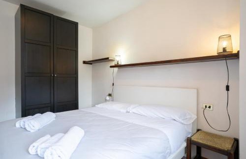 Barzio Apartamento | Mountain lodging with fireplace and mountain view