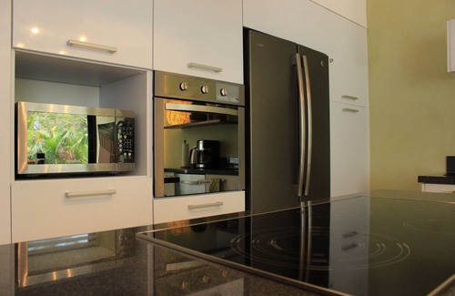 Akumal Casa | My Eco Chic OM Sanctuary con playa, piscinas y club de golf.
