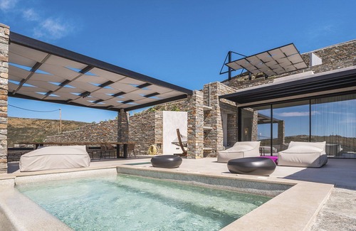 Vourkari Villa | My Rental Homes - Villa Kronos with lounge area and a heated Jacuzzi-plunge pool.