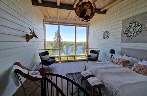 Ahtari Apartamento | Naava Chalet Loft 303 - kaksikerroksinen lasiseinähuoneisto järvinäköalalla