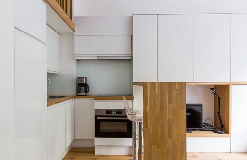 Quartier de la Monnaie Apartamento | Entresuelo 1BR contemporáneo con minutos de jardín de Notre-Dame, por Veeve