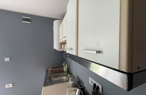 Becej Apartamento | Enchanting apartment complex with a stunning yard, gym, and sports equipment.
