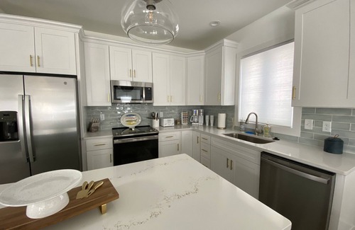 Fenwick Island Casa | New 5 bedroom & 6 bathroom waterfront home on canal with pool close to beach!