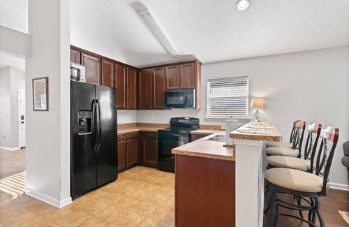 Northside Casa | NEW! Cozy home w fire pit, minutes from airport! Foosball table & so much more!