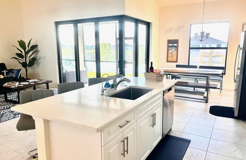 Burnt Store Casa | New House with Step Free Entry, Canal, Fish, Sunset Views, Near Golf & Baseball.