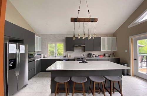 Val-des-Monts Villa | NEW! Lakefront Paradise: Spacious 5-Bedroom Retreat with Hot Tub Bliss