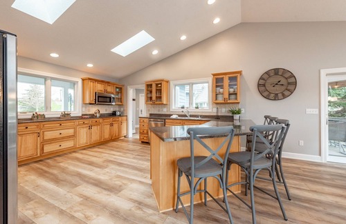 Waterfront Greens Casa | New! Lakefront Retreat: Lakefront, Dock Slip, Hot Tub, Fire Pit!