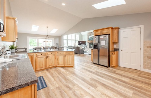 Waterfront Greens Casa | New! Lakefront Retreat: Lakefront, Dock Slip, Hot Tub, Fire Pit!
