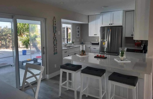 The Dunes Casa | Newly renovated 2024. Located on golf course with a lake view and pool.