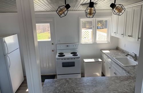 Pictou County Cabaña | Oceanfront beach cottage panoramic views spectacular sunsets sandbars warm water