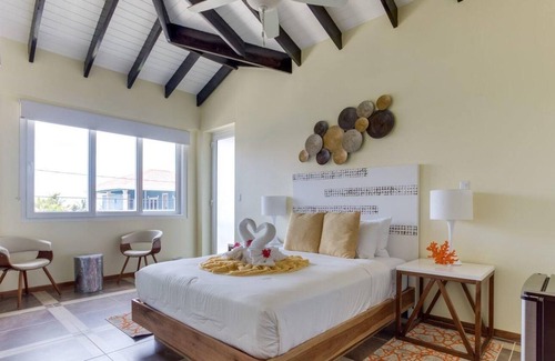 Placencia Complejo | Oceanfront Condo w/ Large Veranda & WiFi - Steps to Beach, Shops, & Dining