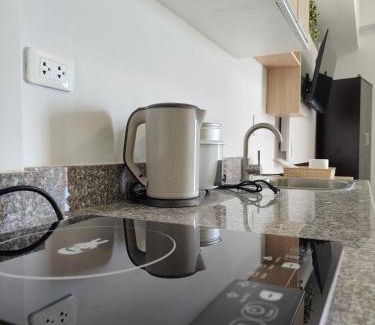 Mactan Export Processing Zone Apartamento | OVERTIME STAYCATION - Nearest to Airport with FREE POOL & GYM ACCESS