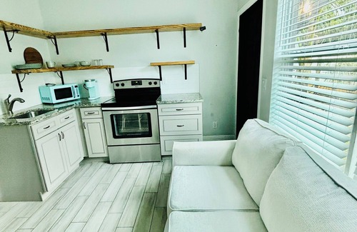Southwest Cabaña | Palm beach cottage in zen tropical setting near beach & shops.