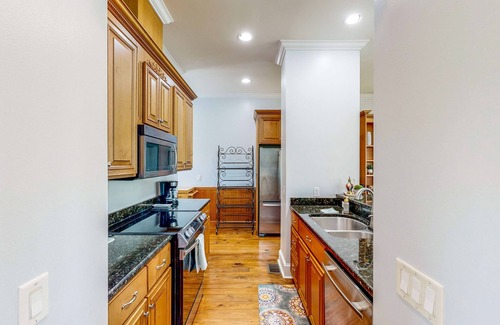 St. Marys Casa | Palm-lined home with dock access, firepit & inviting balconies