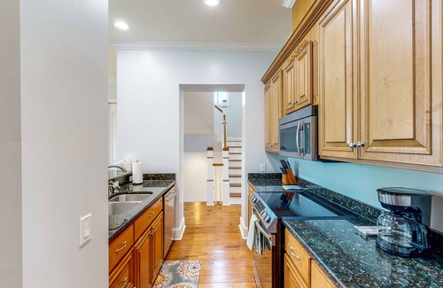 St. Marys Casa | Palm-lined home with dock access, firepit & inviting balconies