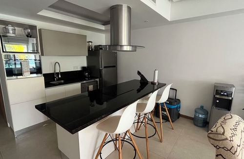 Flamingos Condominio | Paradise Front Beach Condo con antena de TV SHAW y servicios adicionales