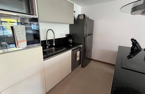 Flamingos Condominio | Paradise Front Beach Condo con antena de TV SHAW y servicios adicionales