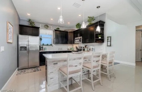 Trafalgar Casa | Paradise of Cape Coral on Canal, with Heated Pool, Tiki Hut Grill & Elec Bikes