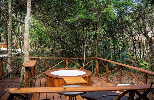 Akumal Cabina | Peaceful Getaway in the Jungle with AC and private deck with Hot Tub.