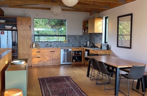 Matapouri Casa | Peaceful 4-Bedroom Beach House across road from estuary & fantastic beach views
