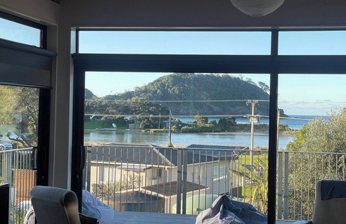Matapouri Casa | Peaceful 4-Bedroom Beach House across road from estuary & fantastic beach views