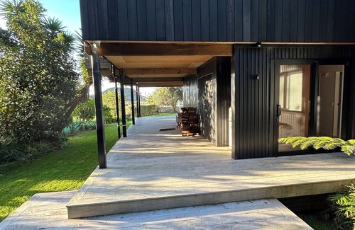 Matapouri Casa | Peaceful 4-Bedroom Beach House across road from estuary & fantastic beach views