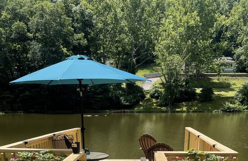 Cross Lanes Cabina | Peaceful fishin’ camp on a lake, bring your dog, and fishing pole.