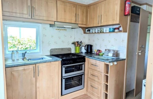 Bryn-crug Casa | Peaceful, woodland caravan site with pool and bar