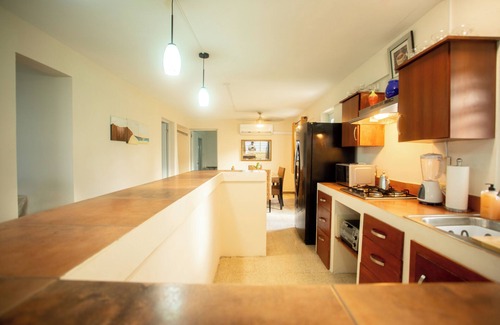 Rio Grande Cama Y Desayuno | PELICAN REEF BEACHFRONT 2 BED 1 BATH A/C ON SMALL FARM, SURF RIGHT OUT FRONT