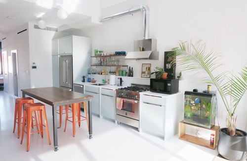 Hunters Point Casa | Penthouse w/ large rooftop Manhattan skyline in 2 family Townhome