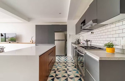 Americana Condominio | Penthouse with private rooftop and panoramic views