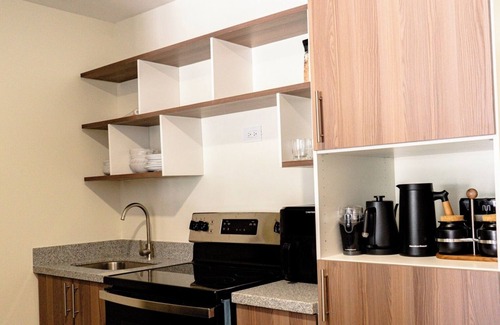 Santa Tecla Condominio | Penthouse with Volcano Views & Top Amenities - AC, Gym, Lounge, Patio, Workspace