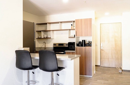 Santa Tecla Condominio | Penthouse with Volcano Views & Top Amenities - AC, Gym, Lounge, Patio, Workspace