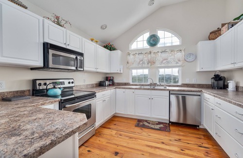 Sea Scape Casa | Pet-friendly Kitty Hawk home with private heated pool, volleyball court, and more