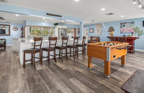 Bal Harbour Casa | Pirates Den a 4BR Pet-Friendly Waterfront Oasis with Pool, Dock, Personal Water Boats, Fire Pit, Game Room and Bar