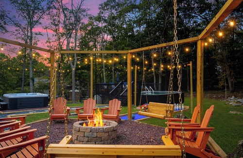 East Stroudsburg Casa | Pocono Dream House! Heated Pool, Fire Pit, Bowling, Mini Golf!