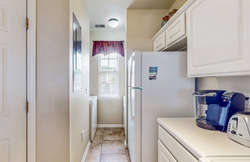 Sunset Beach Condominio | Pond-front condo near beach with balcony, pool, & hot tub - snowbird-friendly