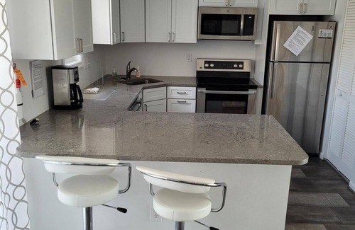 Admiral Estates Condominio | Poverty Beach is right across the street from this newly renovated bright Beach Condo.