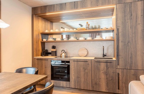 Haus im Ennstal Apartamento | Apartamento vacacional premium con sauna y jardín
