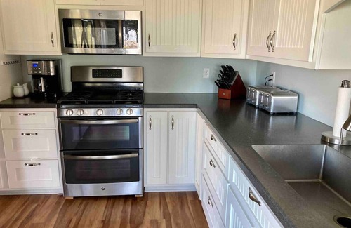 Huron Casa | Private heated pool in back & Sandy beach in front