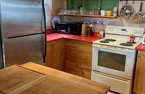 Rosseau Cabaña | Private island on Lake Rosseau in Muskoka: beautiful cottage plus log cabin.