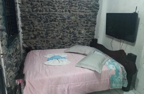 Morada do Ouro Apartamento | Quarto de Pedra
