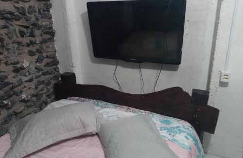 Morada do Ouro Apartamento | Quarto de Pedra
