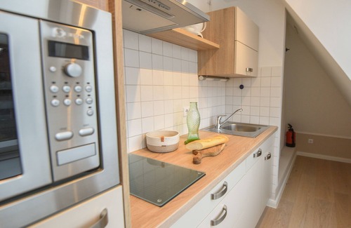 Norderney Apartamento | Tranquilidad y relajación en las casas de arco del asentamiento del casco norte.