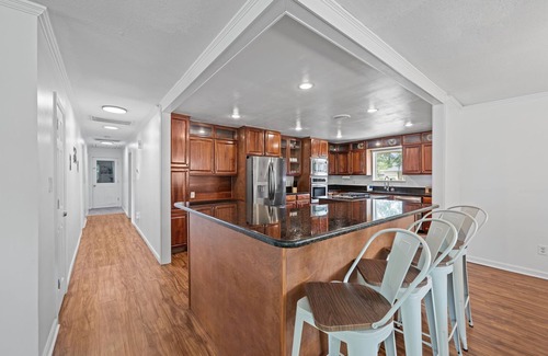 River Bend Casa | Quiet Riverfront 3BR/2BA house with Spa, Dock, and Golf Carts
